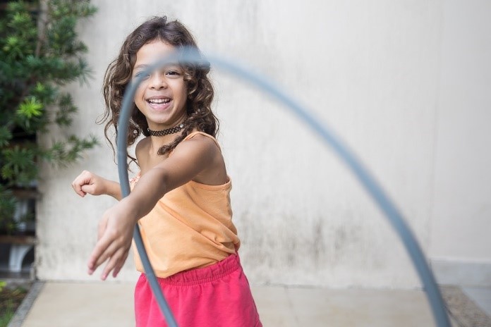 Girl playing with a hoola hoop